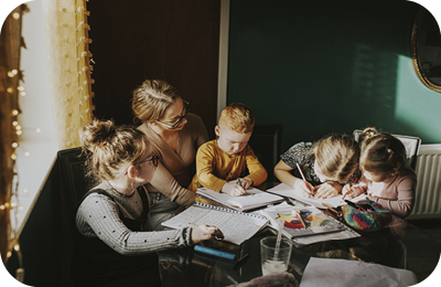 Female with children around table